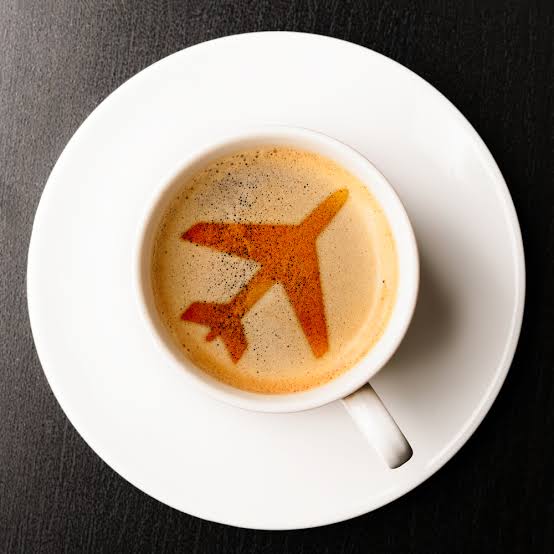 Espresso with an airplane shape in the crema