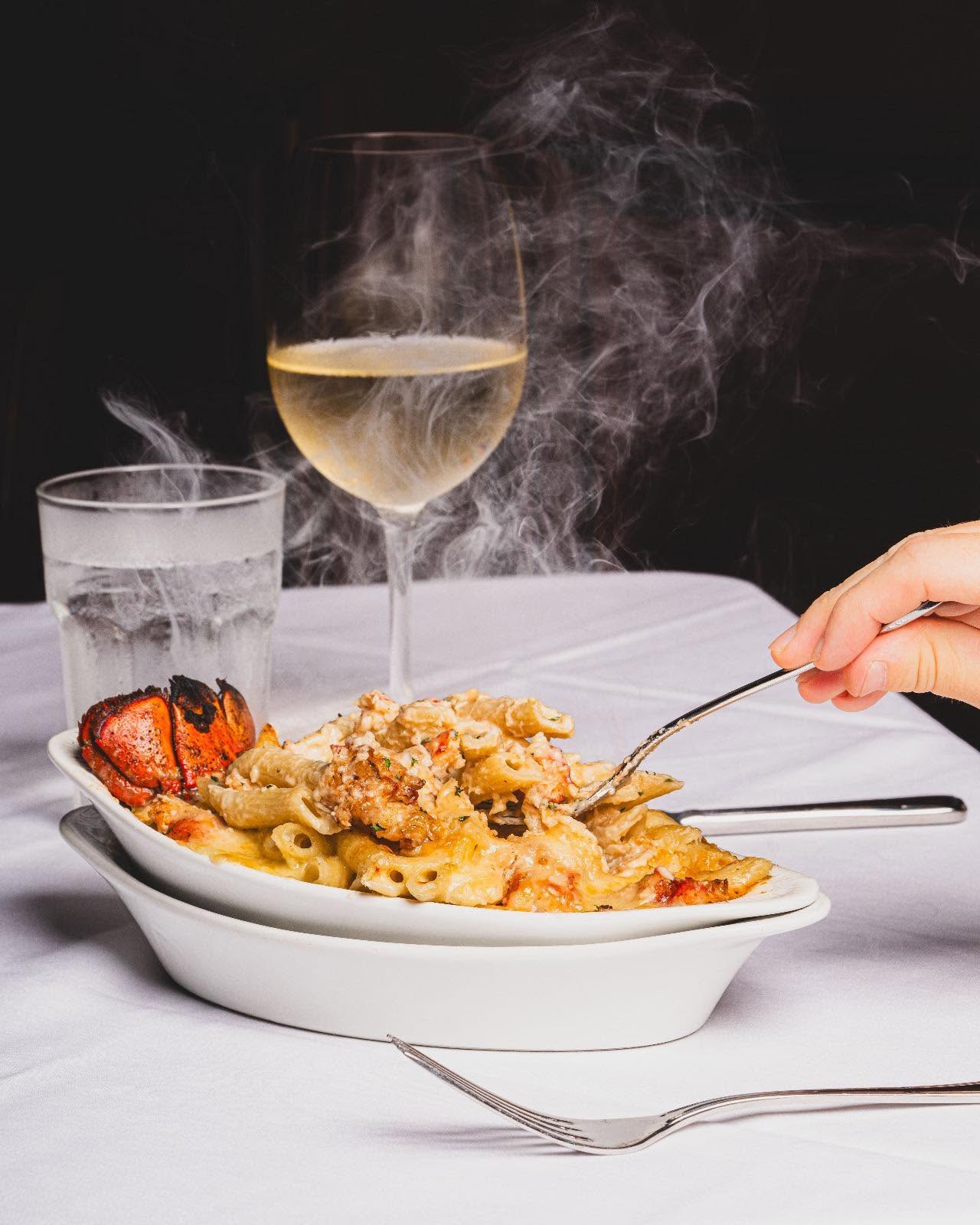 Lobster pasta and a glass of white wine at Hal''s