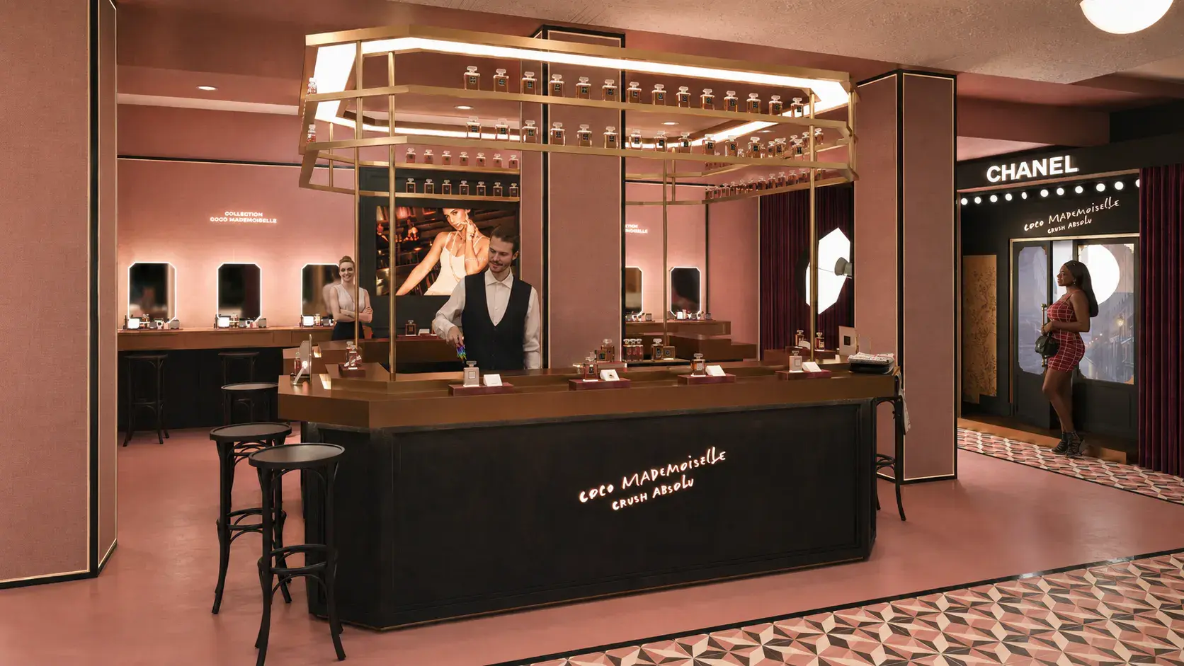 The Coco Mademoiselle Crush Absolu fragrance bar with bottles displayed above a brass counter